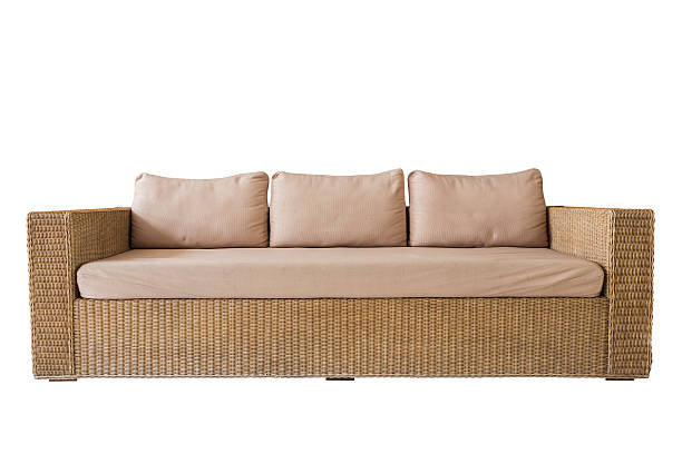 istock Rattan sofa with grey cushions isolated on white 597242108
