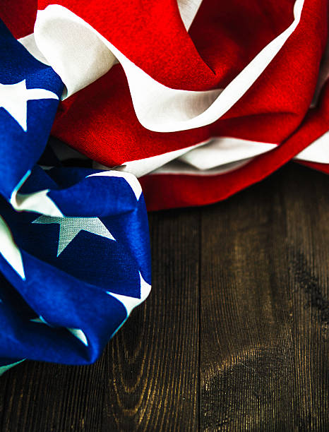 istock American flag on wood table for US holidays 597245554