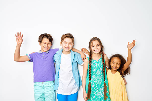 istock Four Fun Kids Against White Background 597252286