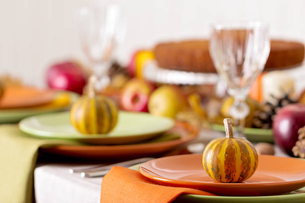 istock Thanksgiving dinner. Seasonal table setting with autumn leaves, 597252908