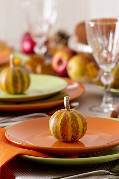 istock Thanksgiving dinner. Seasonal table setting with autumn leaves, 597252956