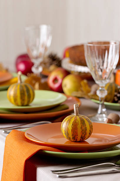 istock Thanksgiving dinner. Seasonal table setting with autumn leaves, 597252998
