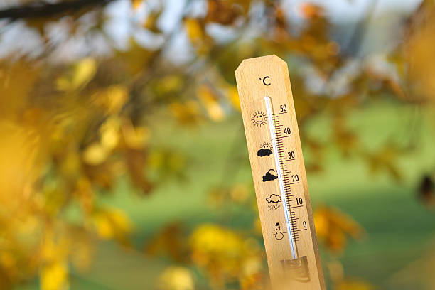 istock nice weather in the autumn shown with mercury thermometer 597253408
