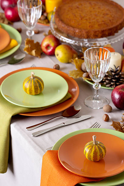 istock Thanksgiving dinner. Seasonal table setting with autumn leaves, 597253432