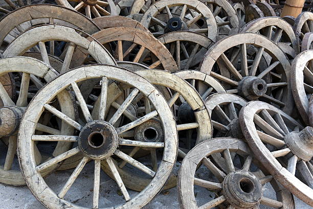 istock wooden wagon wheels 597253454