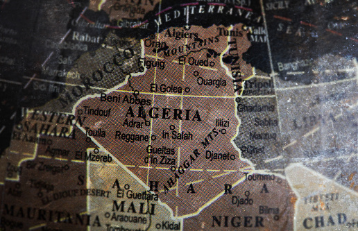 Algeria map on vintage crack paper background, selective focus