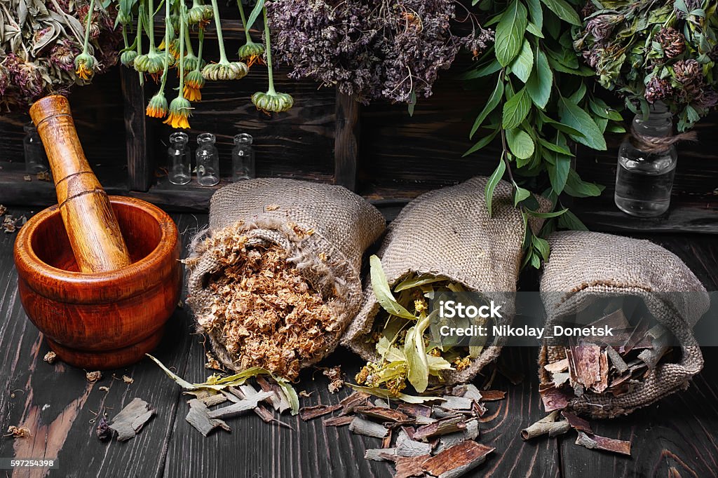 traditional medicinal herb Three bags with dry herbs in a dark key Herbal Medicine Stock Photo