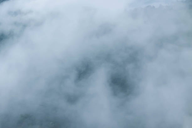 istock Fog and cloud mountain valley spring landscape 597256422