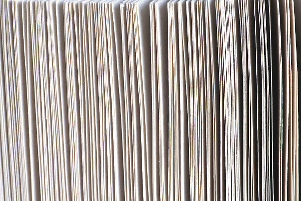 istock old book. seamless texture of book pages. 597256764