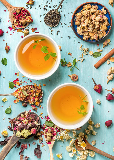 istock Two cups of healthy herbal tea with mint, cinnamon, dried 597257874