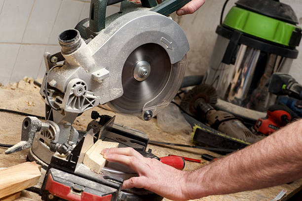 istock Carpenter working. tools on wooden table with sawdust. 597258966
