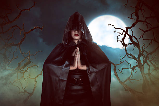 istock Asian witch woman casting spell in the night 597259596