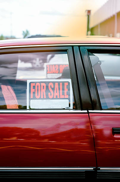 shiny car for sale in summer weather shiny car for sale in summer weather, parked with a red vibrant color exterior. car for sale stock pictures, royalty-free photos & images