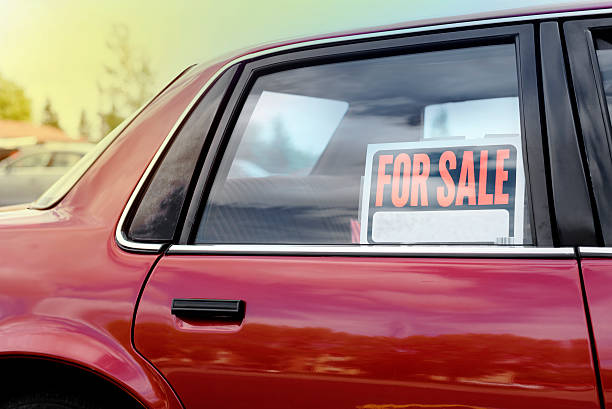 shiny car for sale in summer weather shiny car for sale in summer weather, parked with a red vibrant color exterior. selling stock pictures, royalty-free photos & images