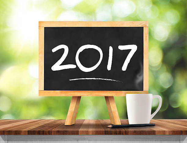 istock new year on blackboard with coffee cup,pencil 597264150