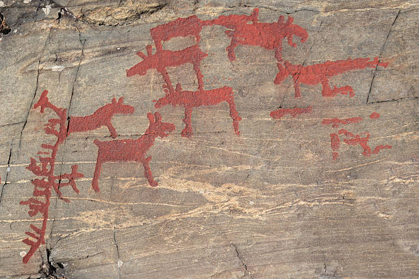 istock Ancient rock paintings in Naesaaker ins Sweden 597264440