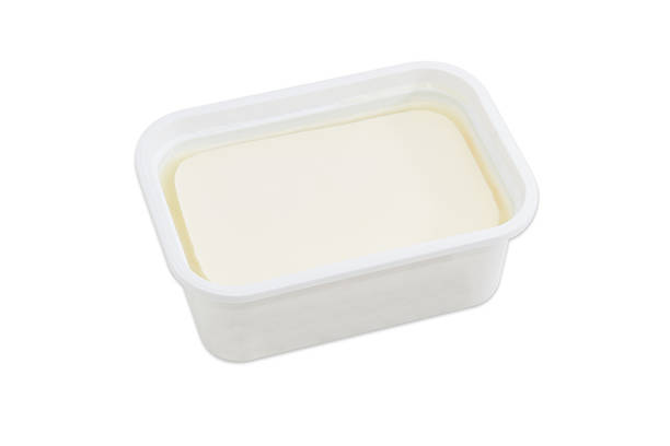 istock Container of feta cheese on a light background 597265758