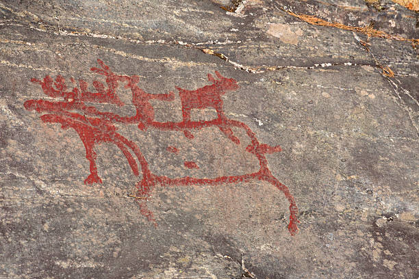 istock Ancient rock paintings in Naesaaker ins Sweden 597266270