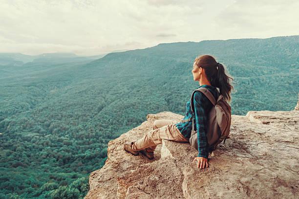 istock Woman enjoying view of mountains 597267646