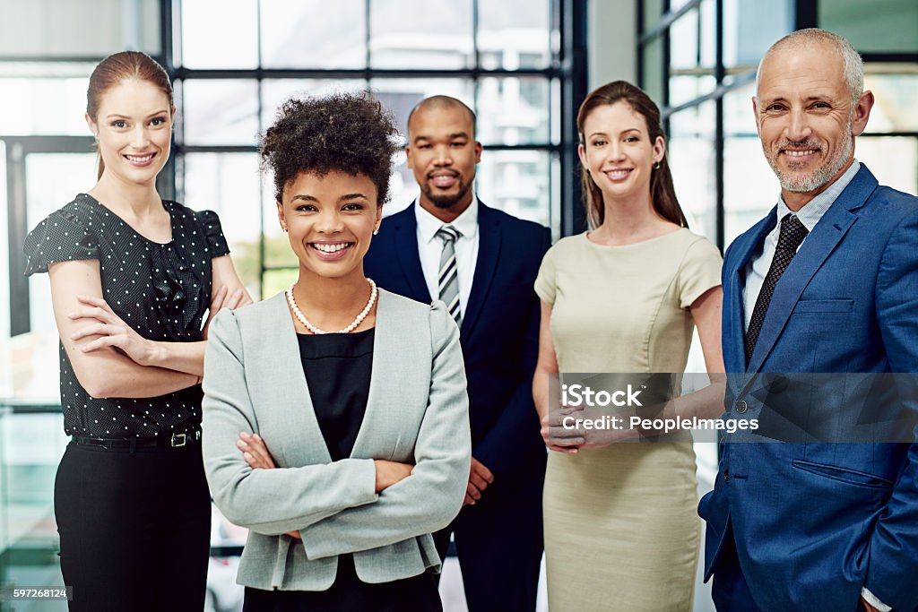 Let's talk about your next business venture Cropped portrait of a diverse group of businesspeople standing in their office Adult Stock Photo