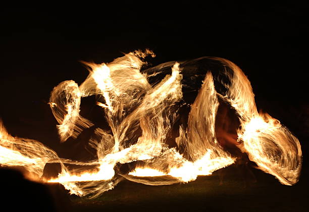 istock Long exposure shot of moving burning torches and fire 597269504