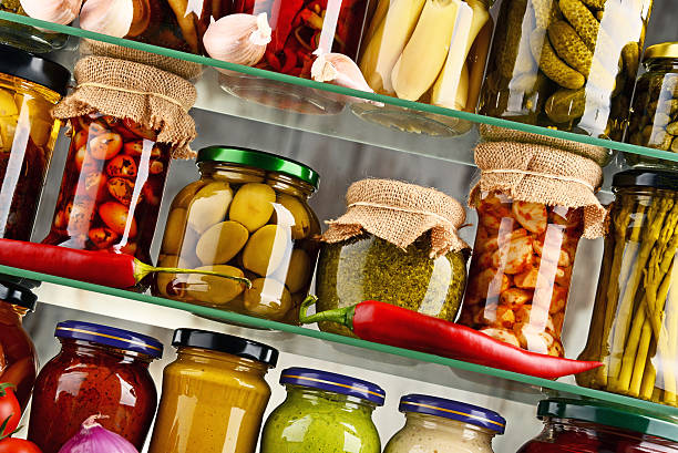 istock Jars with variety of pickled vegetables. 597269524