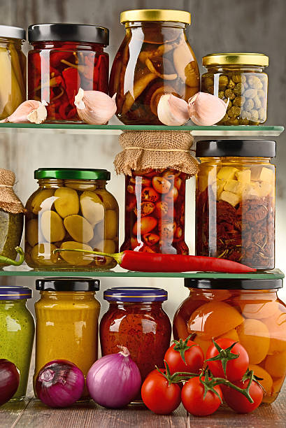 istock Jars with variety of pickled vegetables. 597269606
