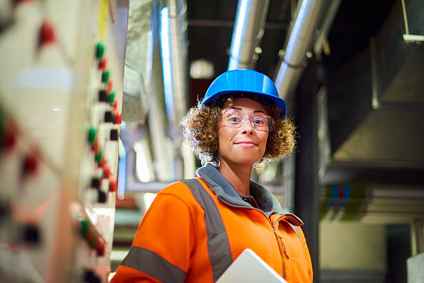 istock proud female boiler room engineer 597269628