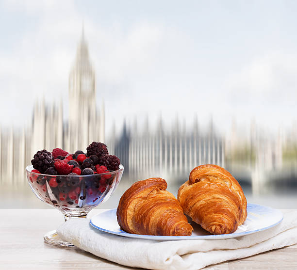 istock Coffee with croissants against London view 597269882