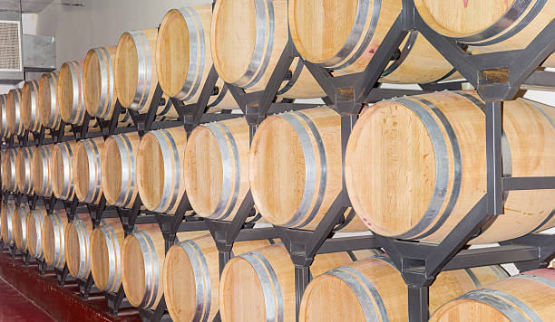 istock Wine in new oak barrels on a shelving 597270186