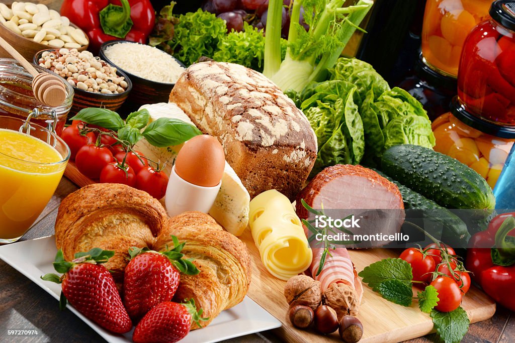 Composition with variety of organic food products Composition with variety of organic food products on kitchen table Baked Stock Photo