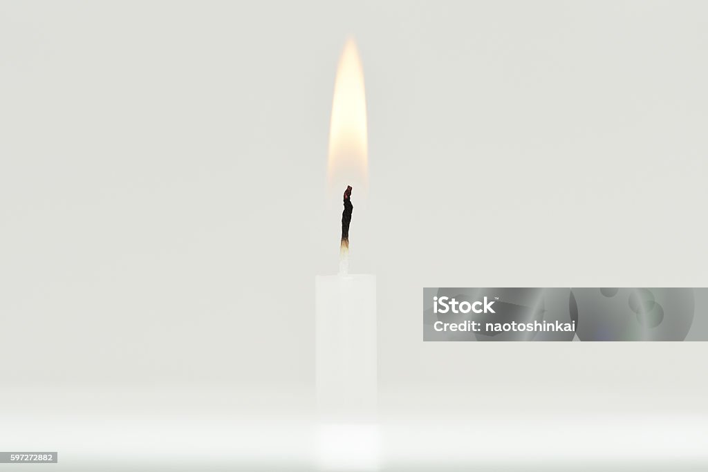 Candle flame on white background. This photo was taken in the studio of Tokyo. Candle Stock Photo