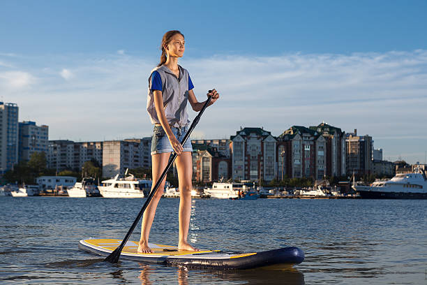 istock Beautiful woman on Stand Up Paddle Board. SUP. 597274122