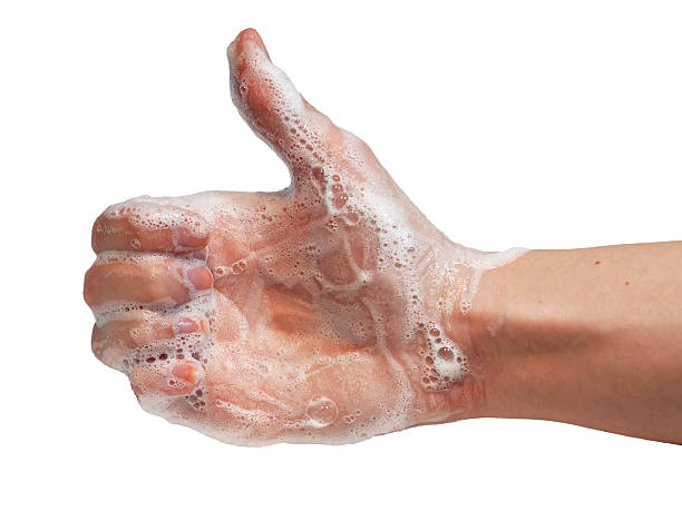 istock Soapy womens hand making thumbs up,isolated on white background 597277304