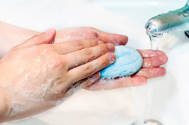 istock Washing of hands with soap under running water 597277910