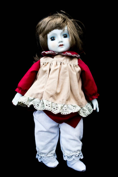 istock Close Up and Isolated Vintage Antique Old Doll 597628984