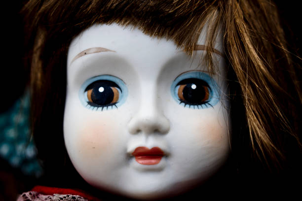 istock Close Up and Isolated Vintage Antique Old Doll 597629288