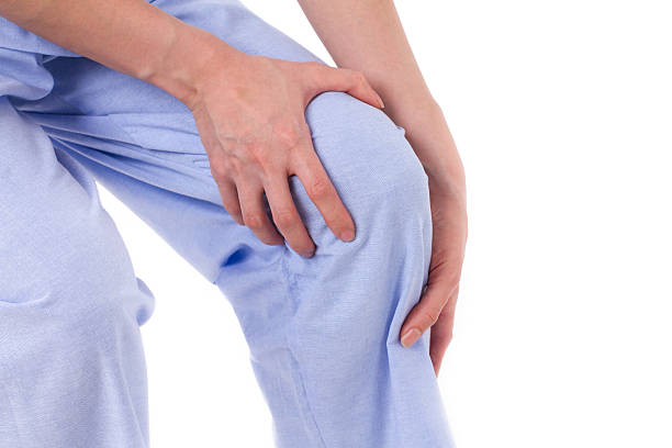 istock woman suffering from knee joint pain, arthritis, gout 597630276