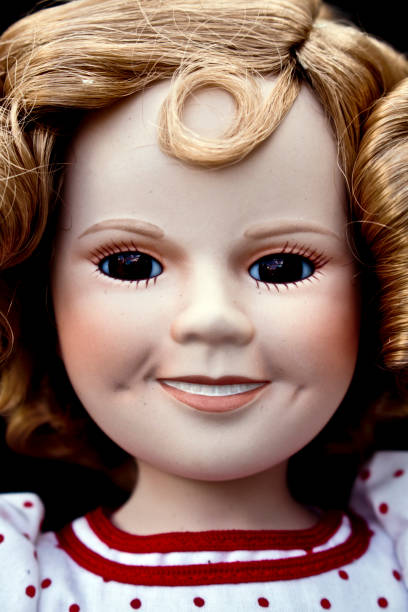 istock Close Up and Isolated Vintage Antique Old Doll 597630298