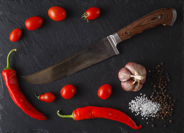 istock Red tomatoes with rosemary and  olive oil. 597630612