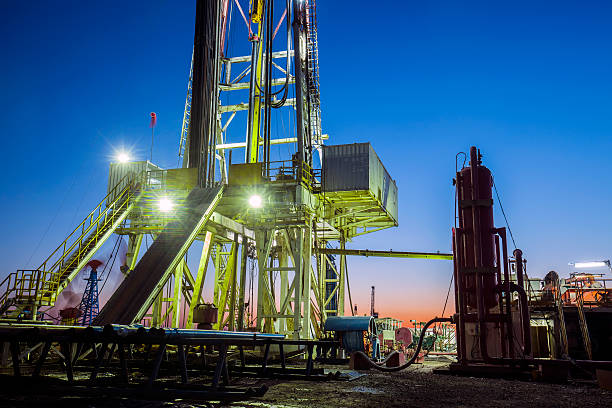 istock oilfield derrick at night 597633962