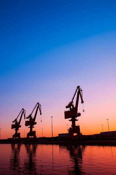 istock In the evening, gantry crane at the dock 597634970