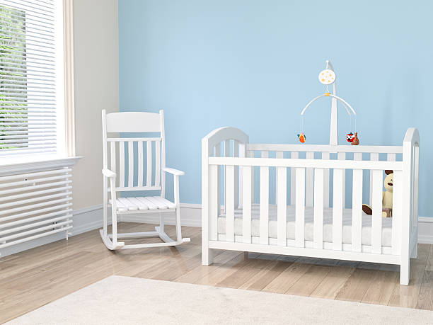 istock Crib in nursery with rocking chair 597637320