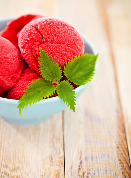 istock Strawberry ice cream in blue bowl 597639096
