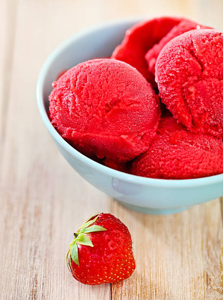 istock Strawberry ice cream in blue bowl 597639198