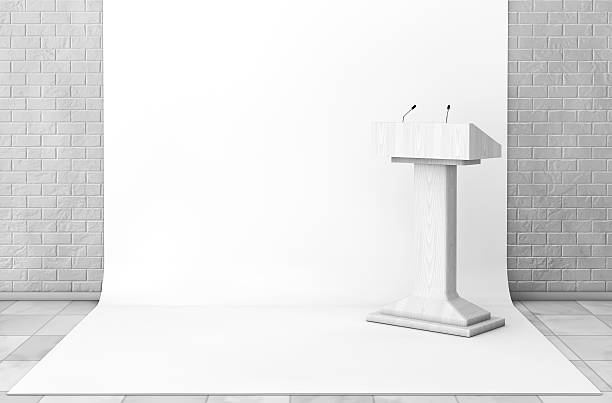 istock Tribune Rostrum Stand with Microphones in Studio Room. 3d Render 597641108