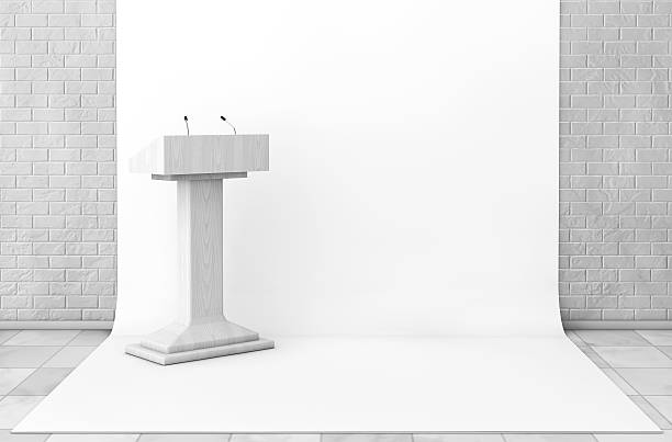 istock Tribune Rostrum Stand with Microphones in Studio Room. 3d Render 597641134