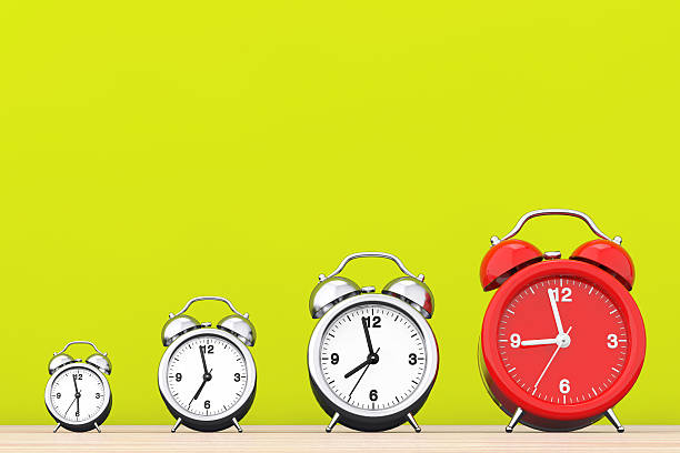 istock Vintage Alarm Clocks with Single Red One.  3d Rendering 597641848