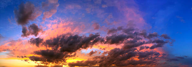 istock Dramatic sunset like fire in the sky with golden clouds 597644062