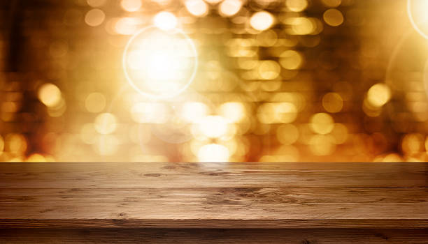 istock Table in front of golden background 597644790